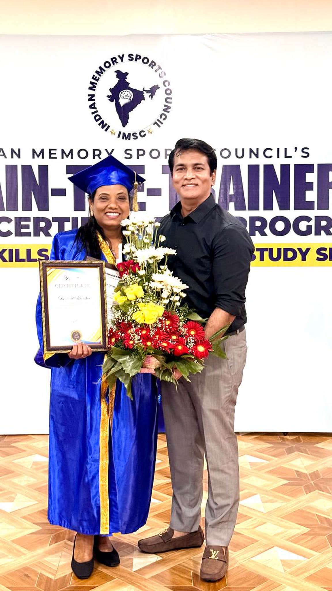 Receiving her certificate and flowers